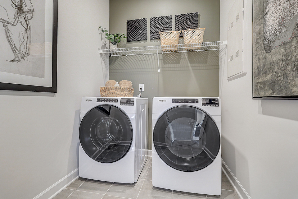 A washing machine in a room.