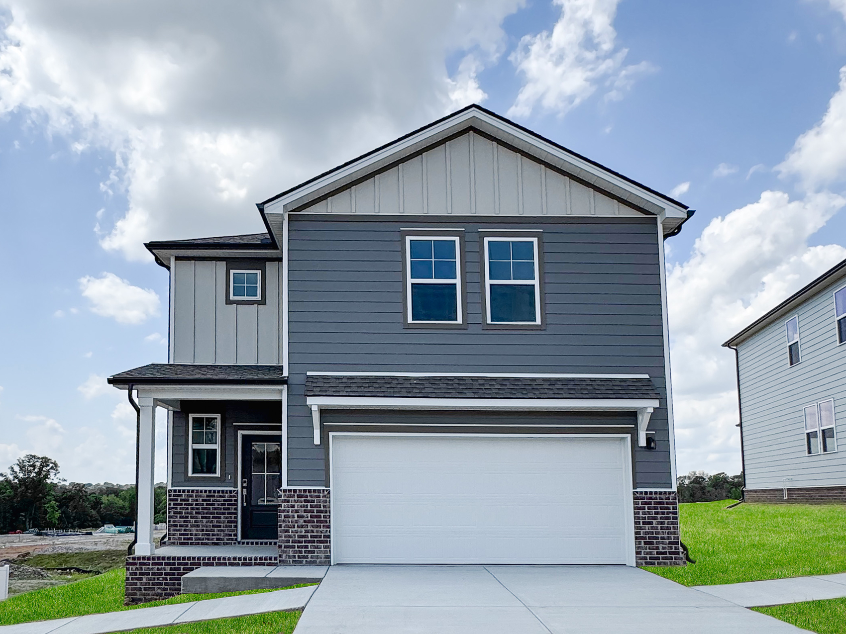 A small house with a garage.