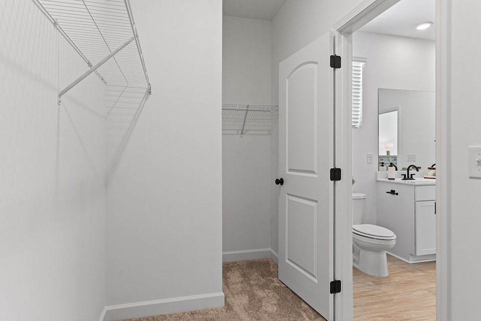 A bathroom with white walls.