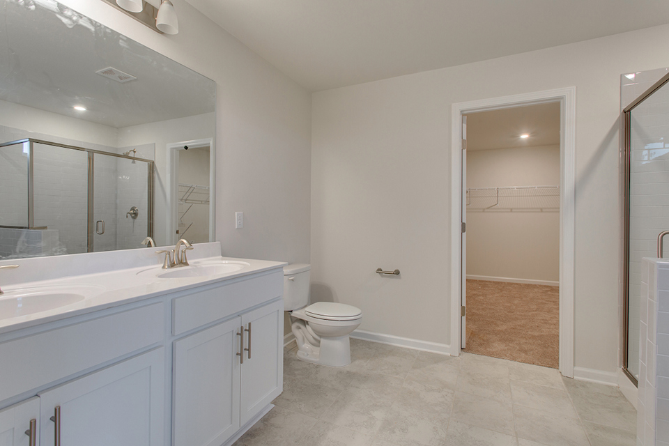A bathroom with a toilet and sink.
