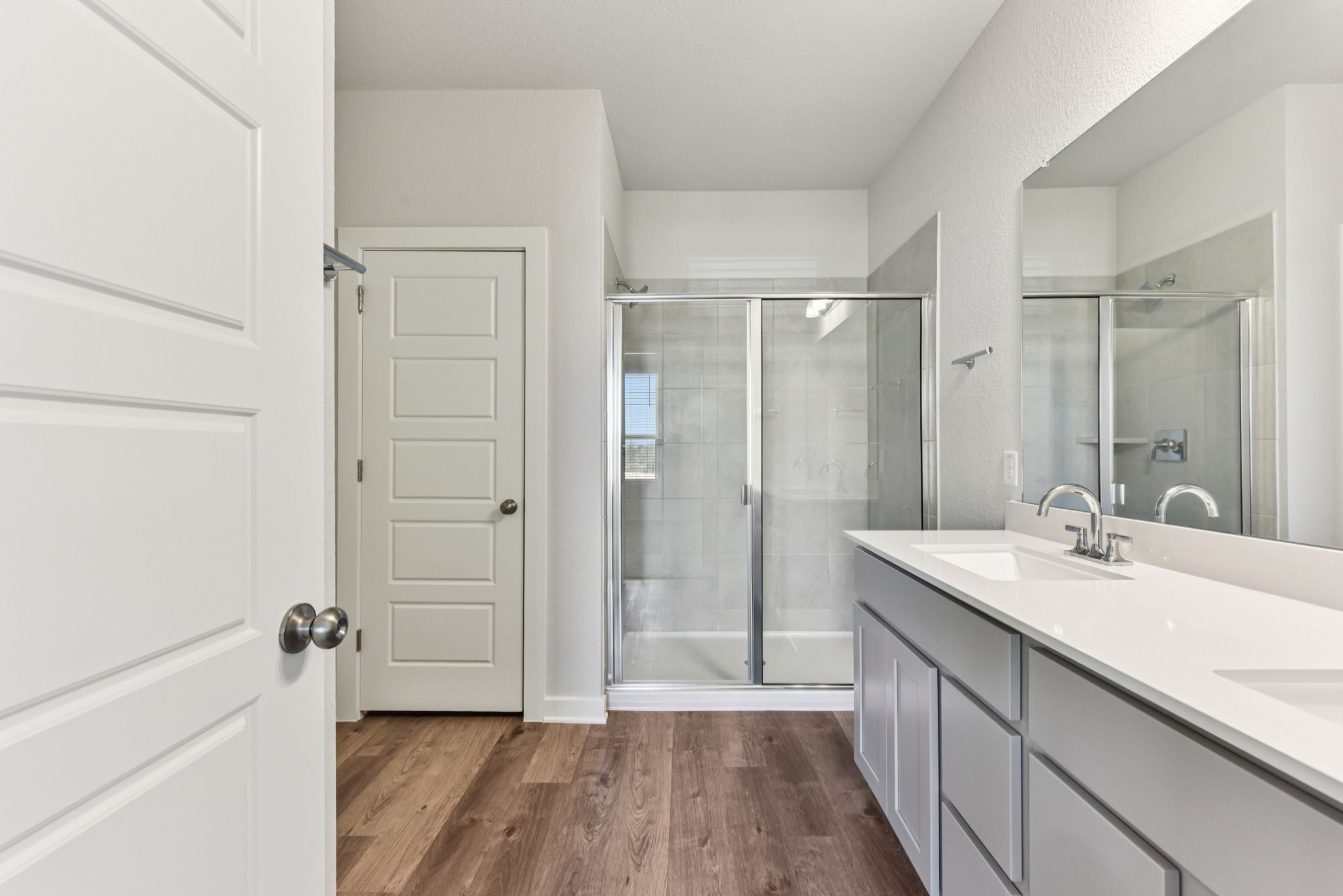 A bathroom with a glass shower.