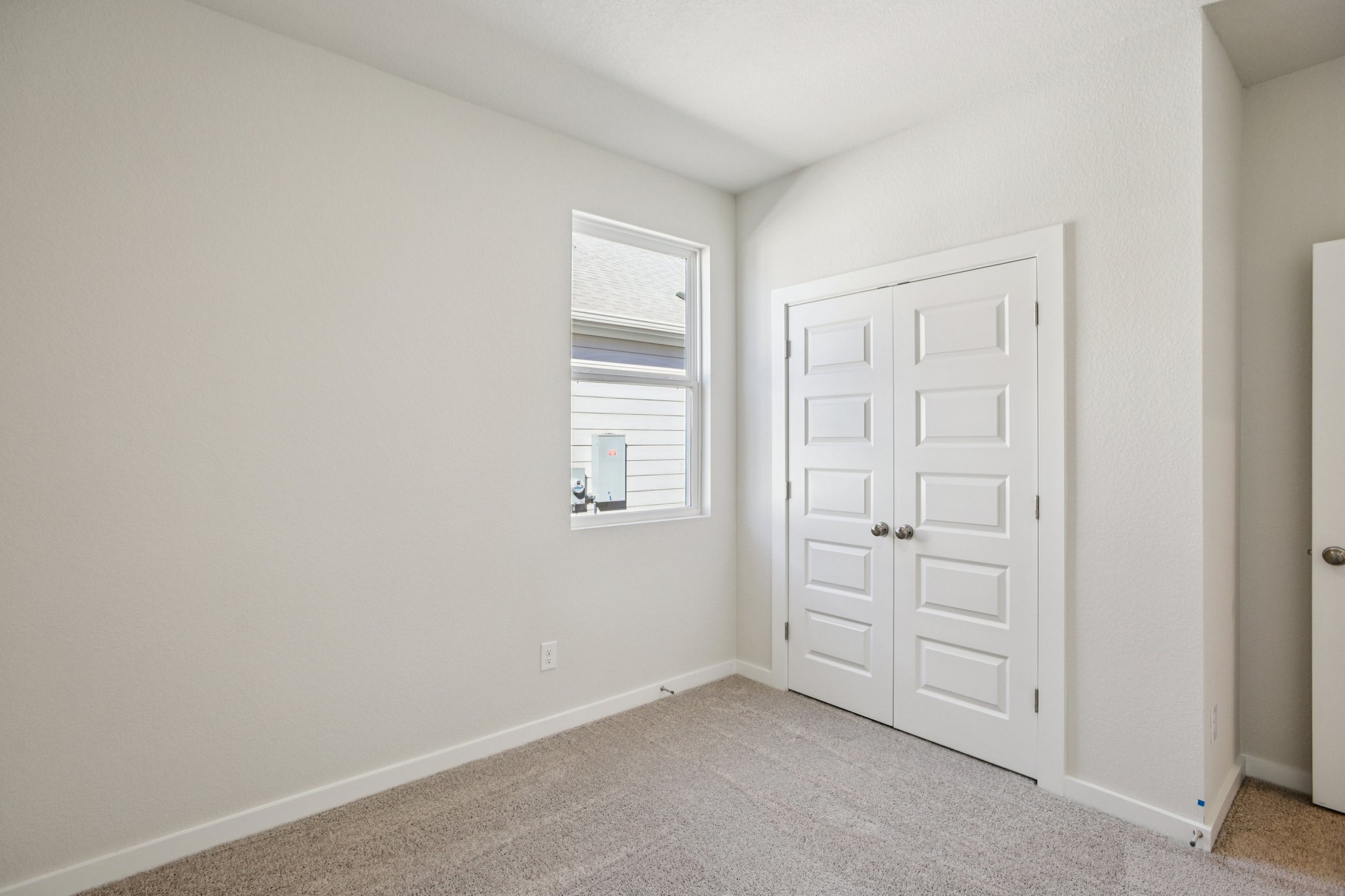 A room with white doors.