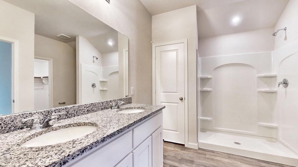 A bathroom with a marble countertop.