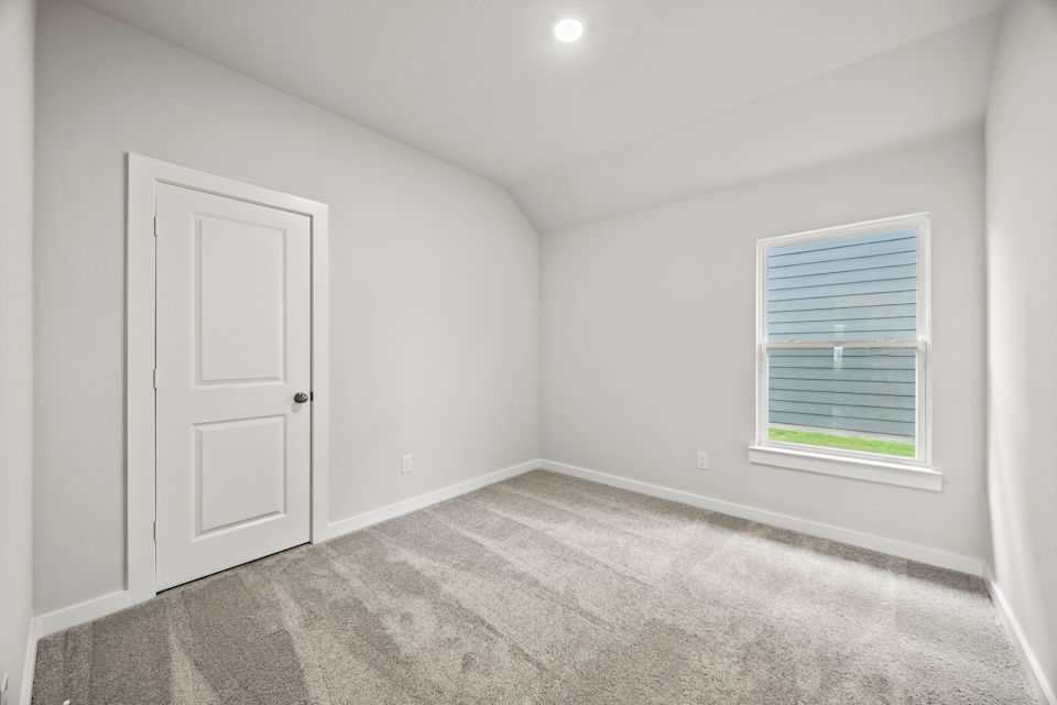 A room with a door and a window.