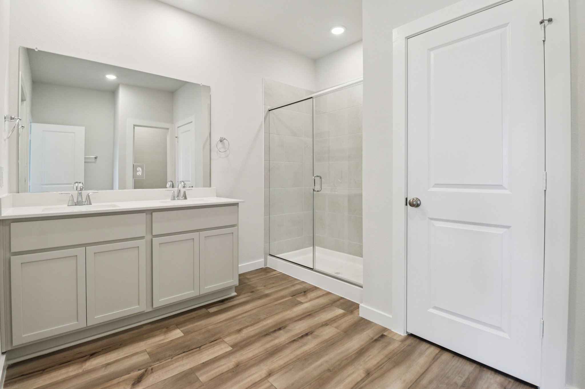 A bathroom with a glass shower.