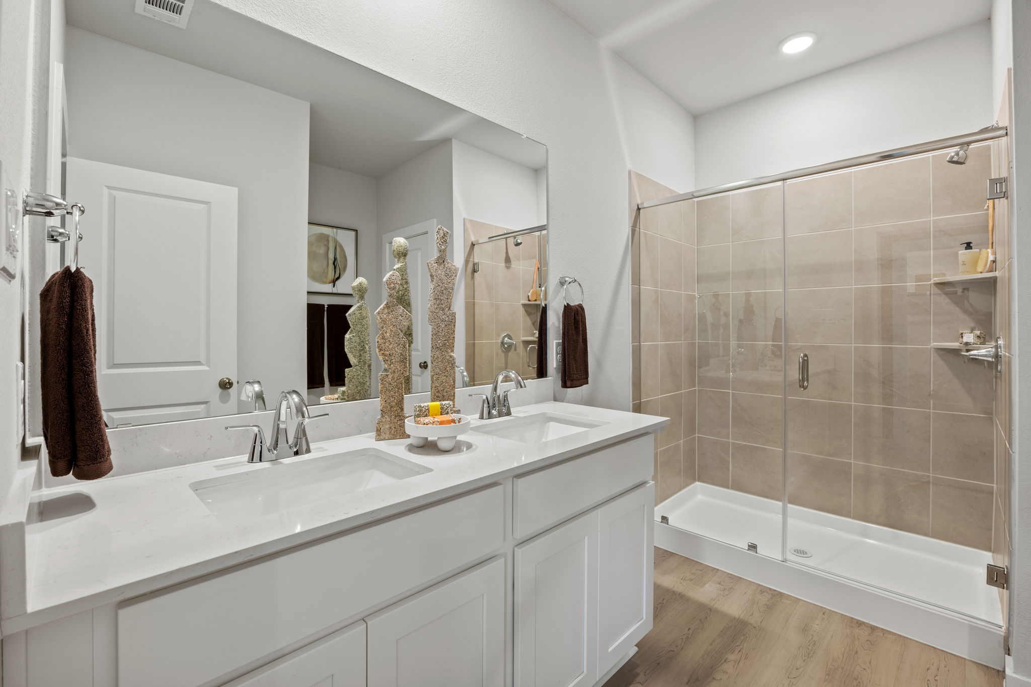 A bathroom with a glass shower.