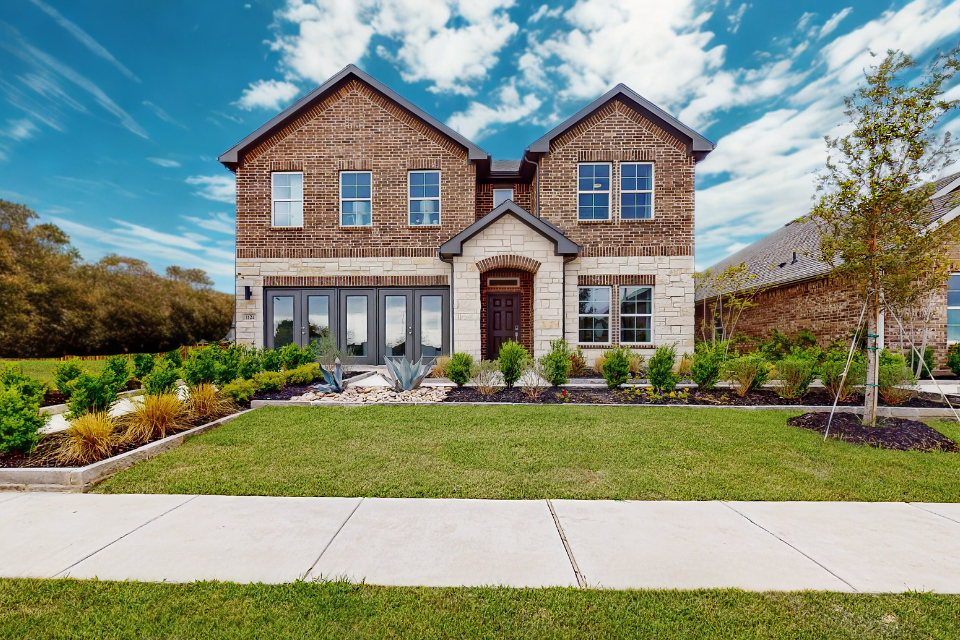 A house with a large front yard.