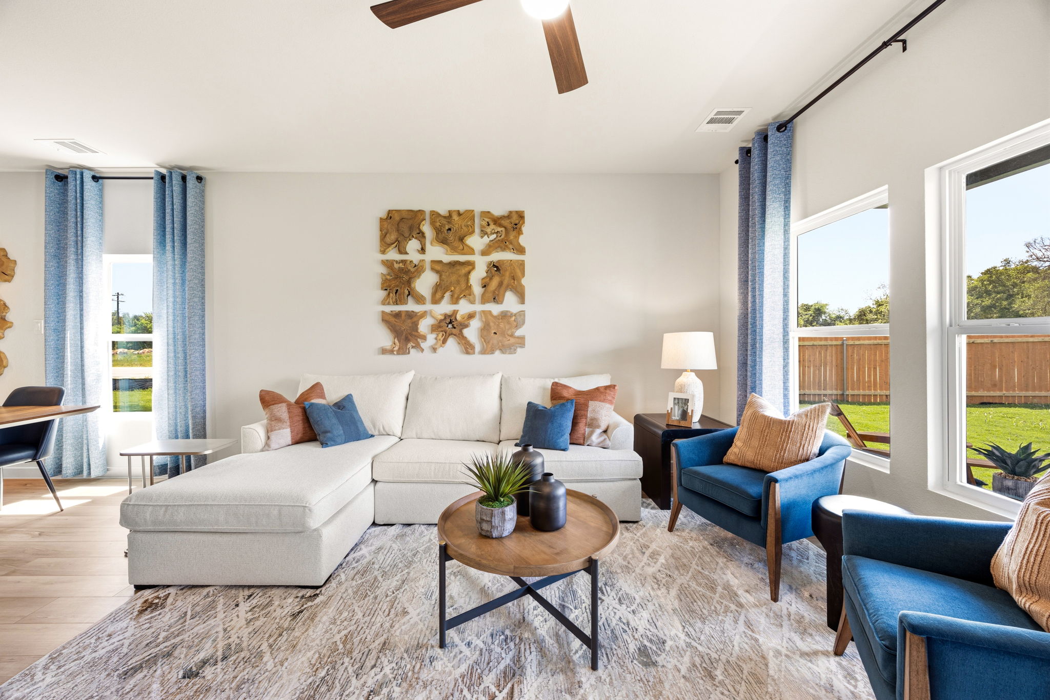 A living room with a couch and chairs.