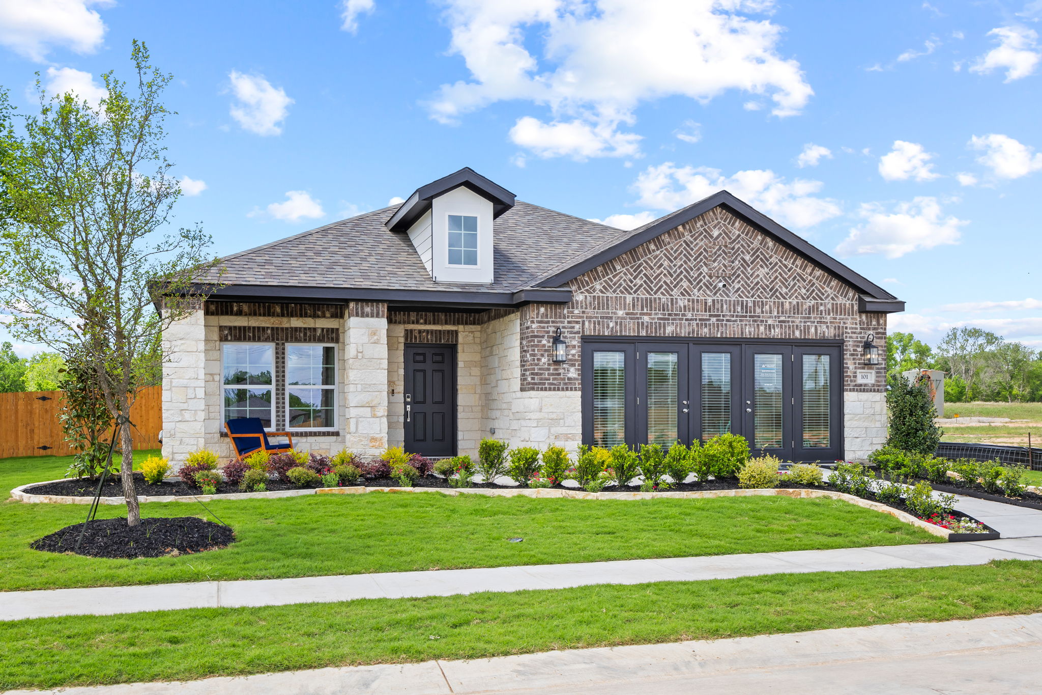 A house with a large front yard.