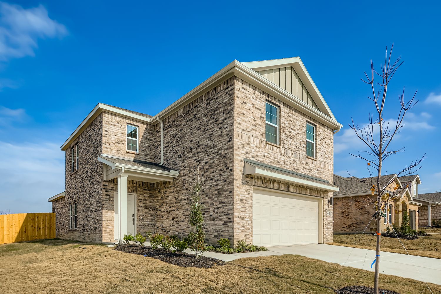 A stone building with a garage.