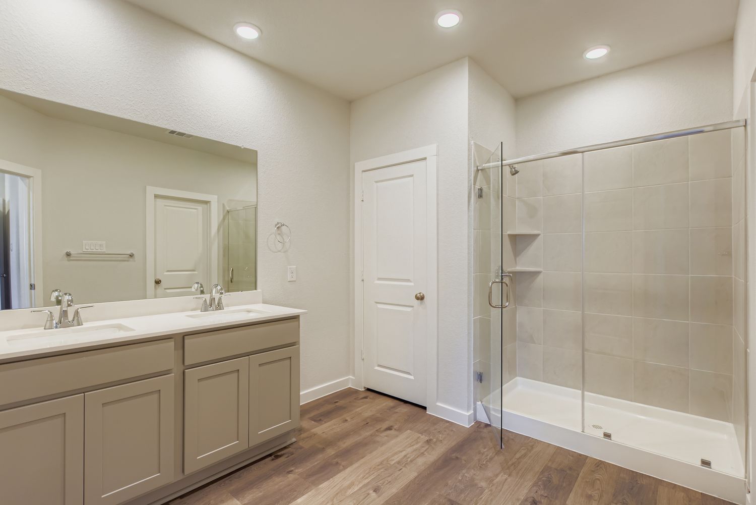 A bathroom with a glass shower.