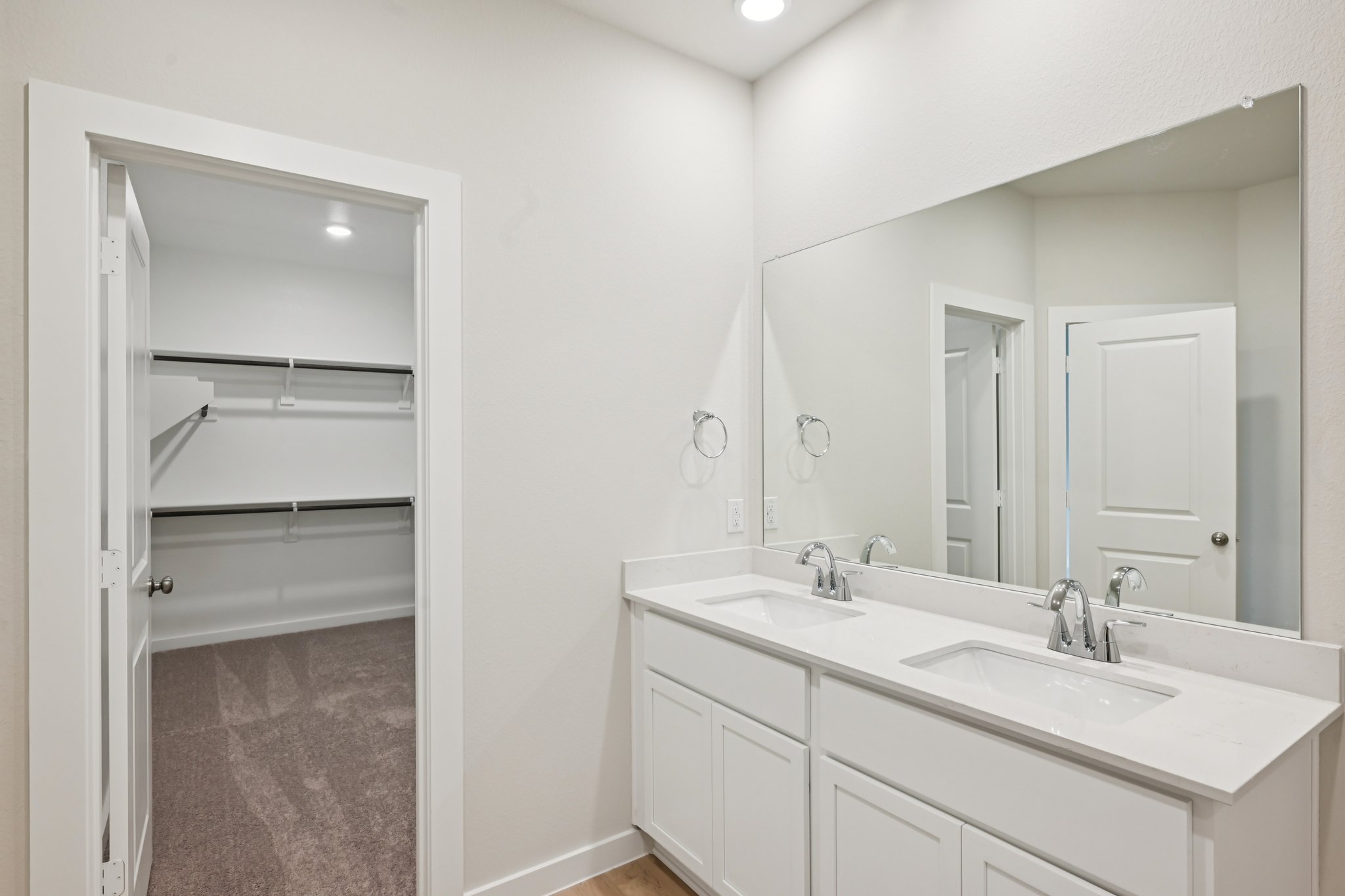 A bathroom with a sink and a shower.