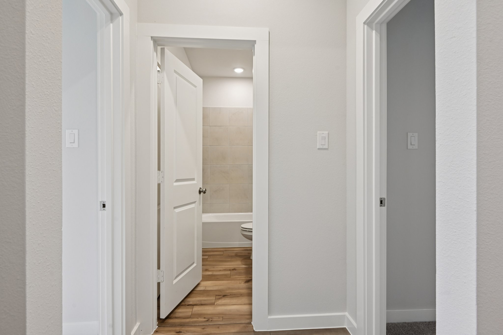 A bathroom with white walls.