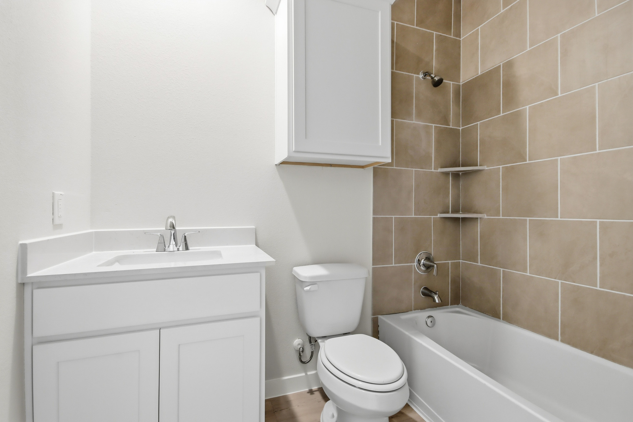 A bathroom with a toilet and sink.