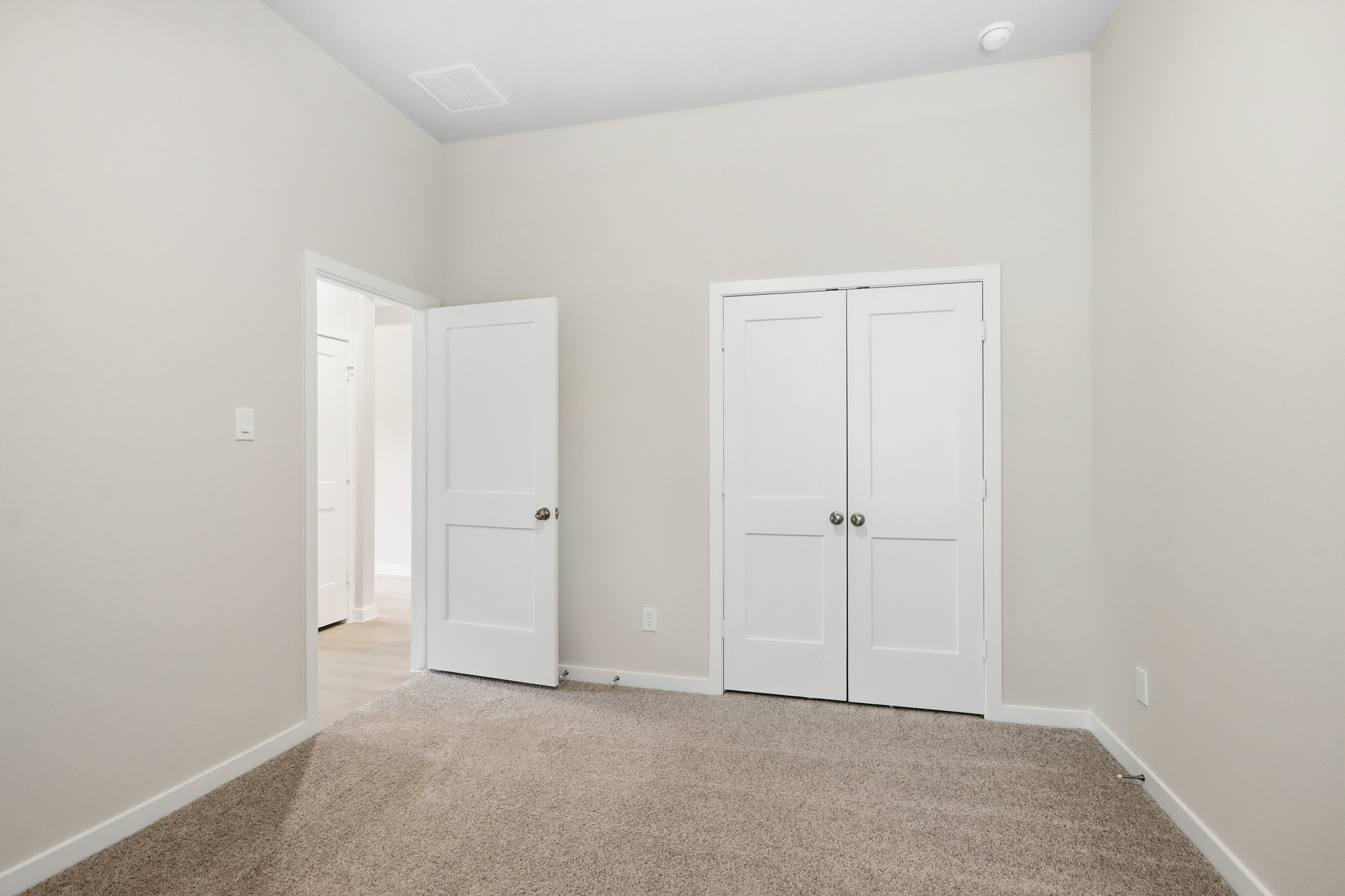 A room with white doors.
