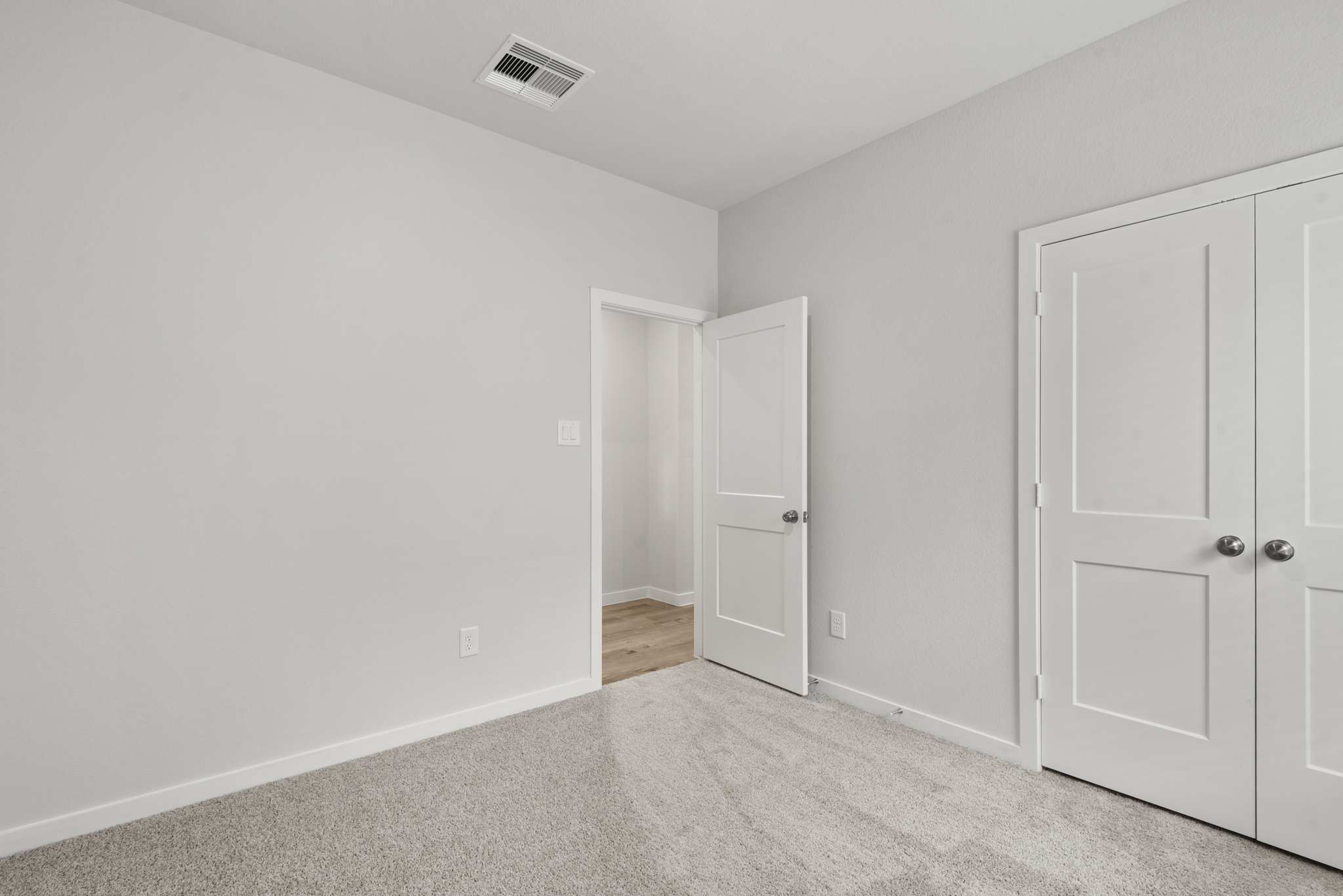 A room with white doors.