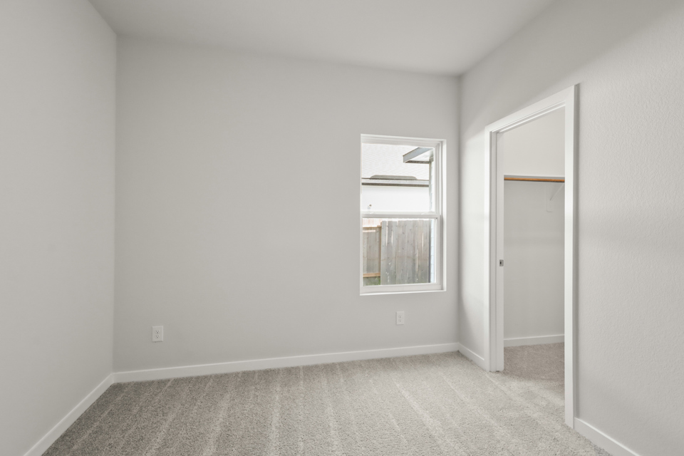 A room with a door and a window.