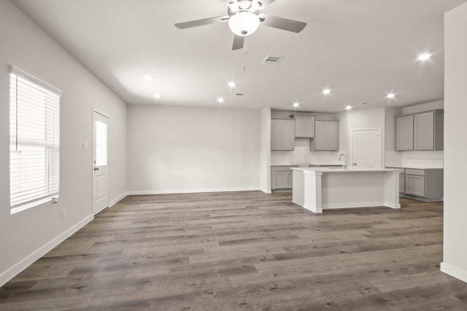 A kitchen with a wood floor.