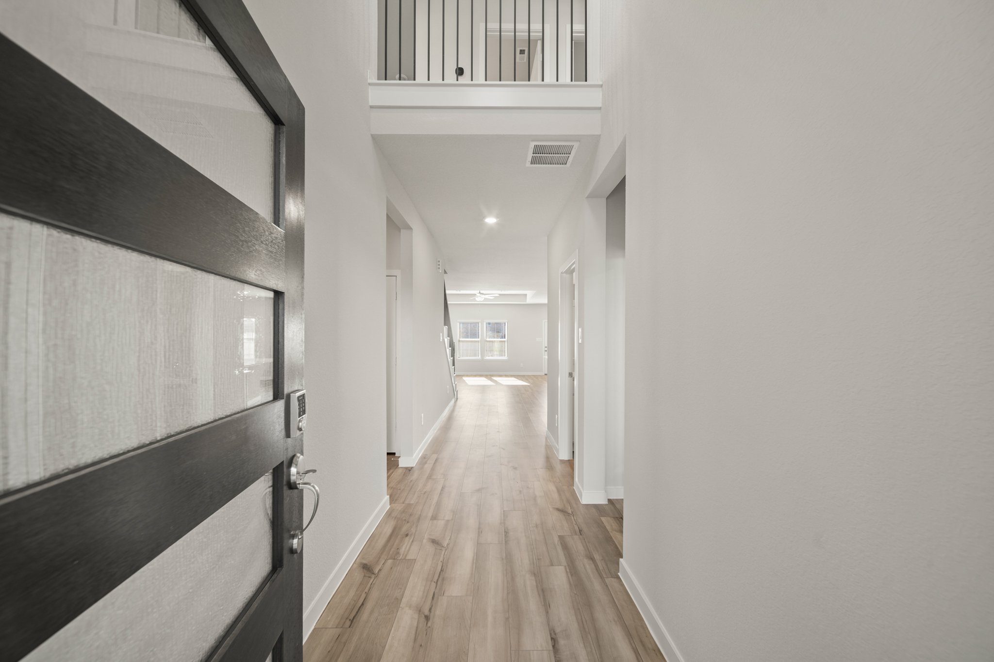 A hallway with white walls.