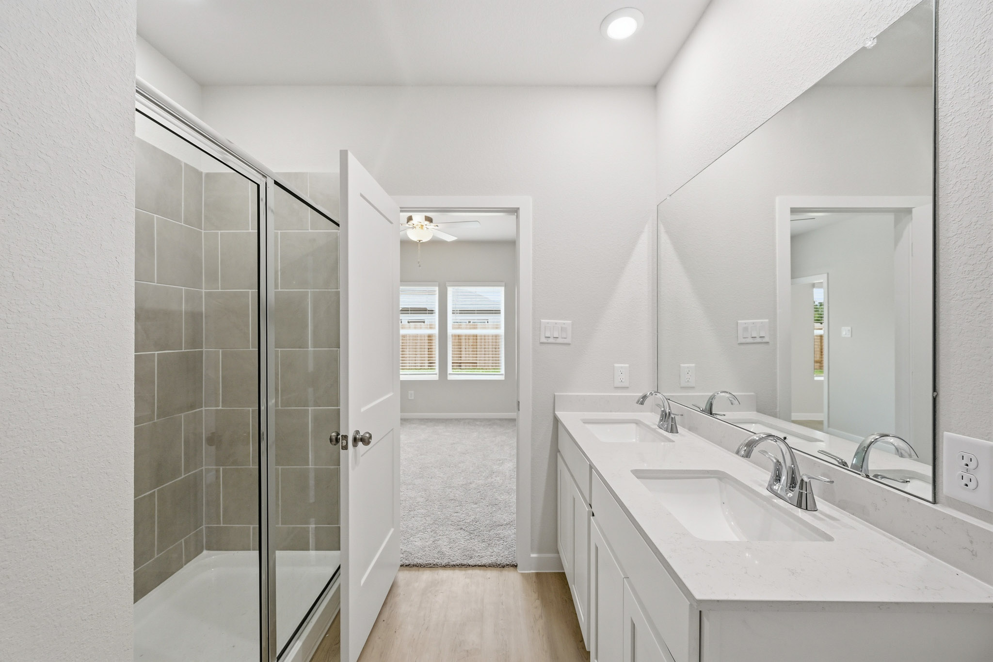 A bathroom with a glass shower.