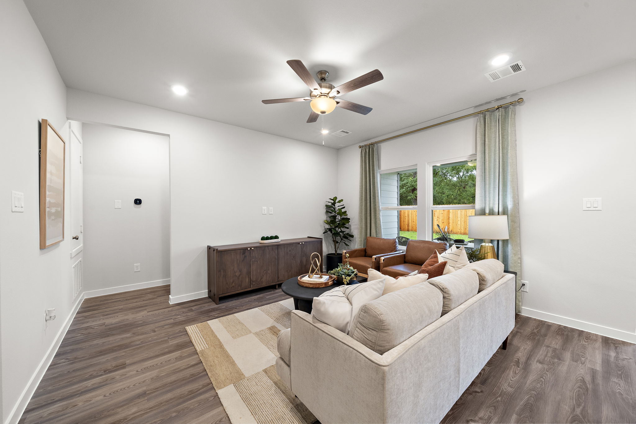 A living room with a couch and a table.