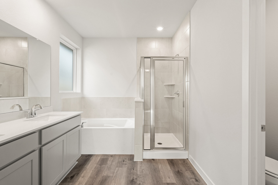 A bathroom with a glass shower.