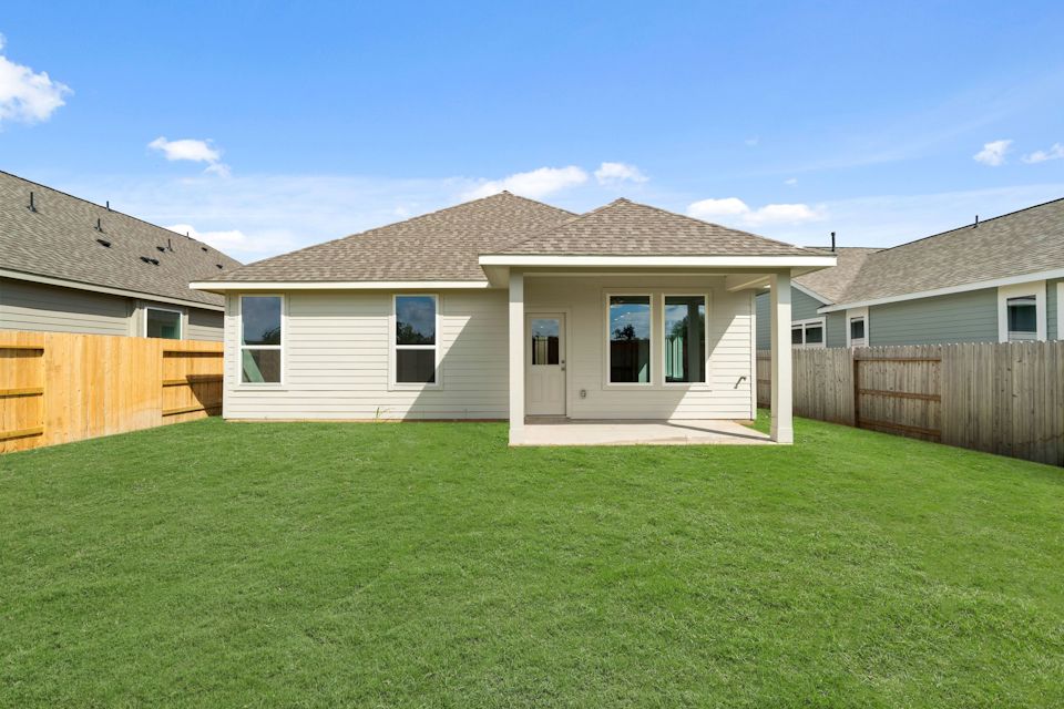 A house with a green lawn.