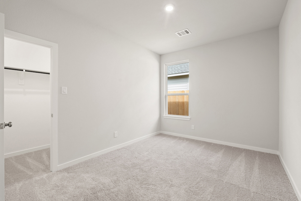 A room with a door and a window.