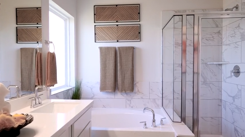 A bathroom with a glass shower.