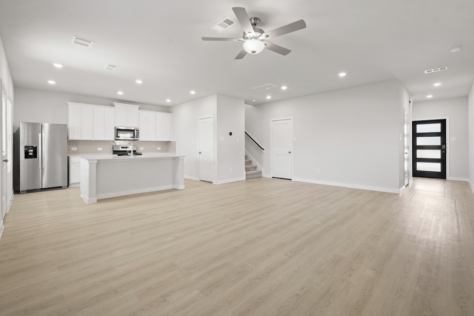 A large kitchen with white cabinets.