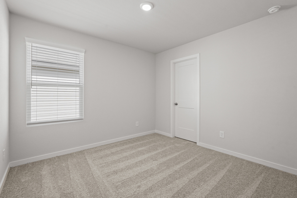 A room with a door and a window.
