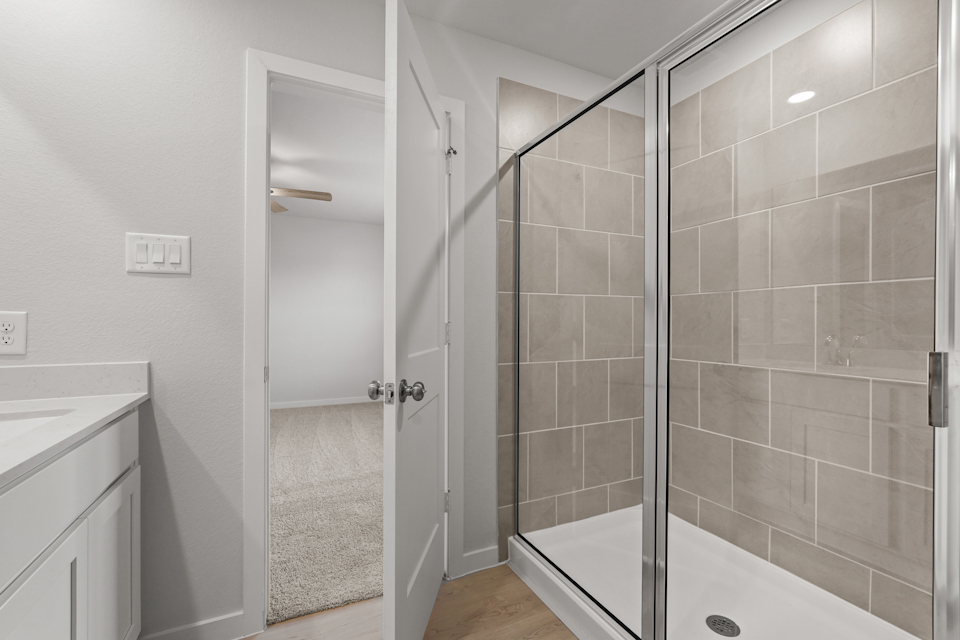 A bathroom with a glass shower.