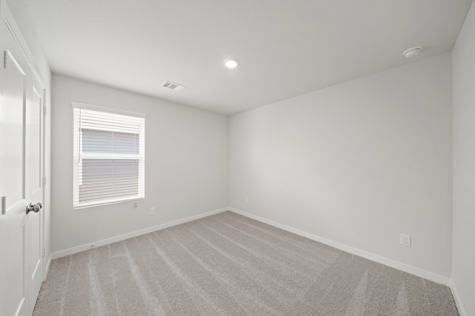 A room with a door and a window.