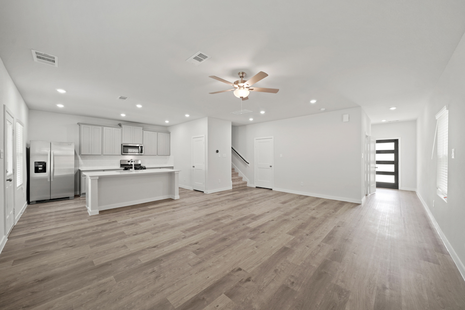A large kitchen with white cabinets.