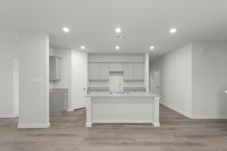 A room with white cabinets.