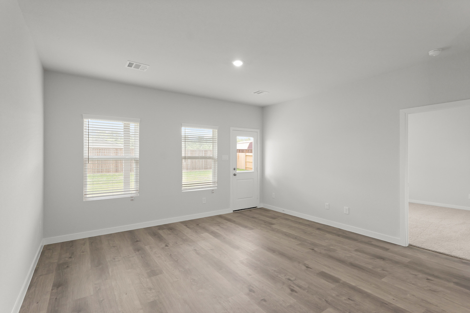 A room with a wood floor and a wood floor.