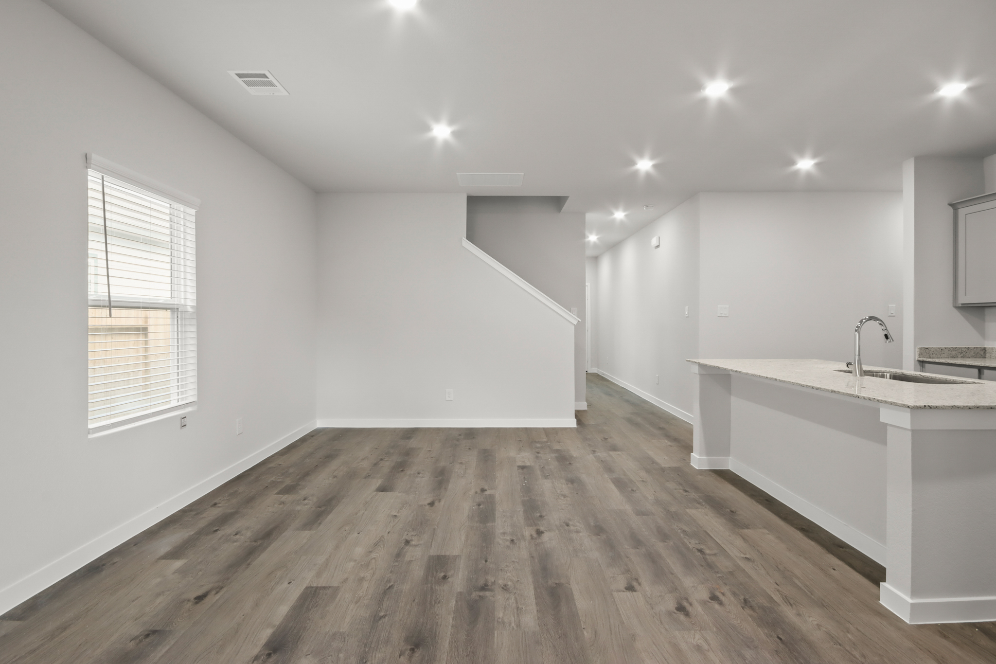A kitchen with white walls.