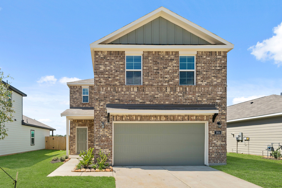 A brick building with a garage.