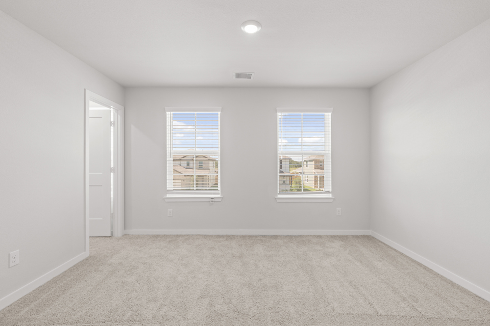 A room with a window and a door.