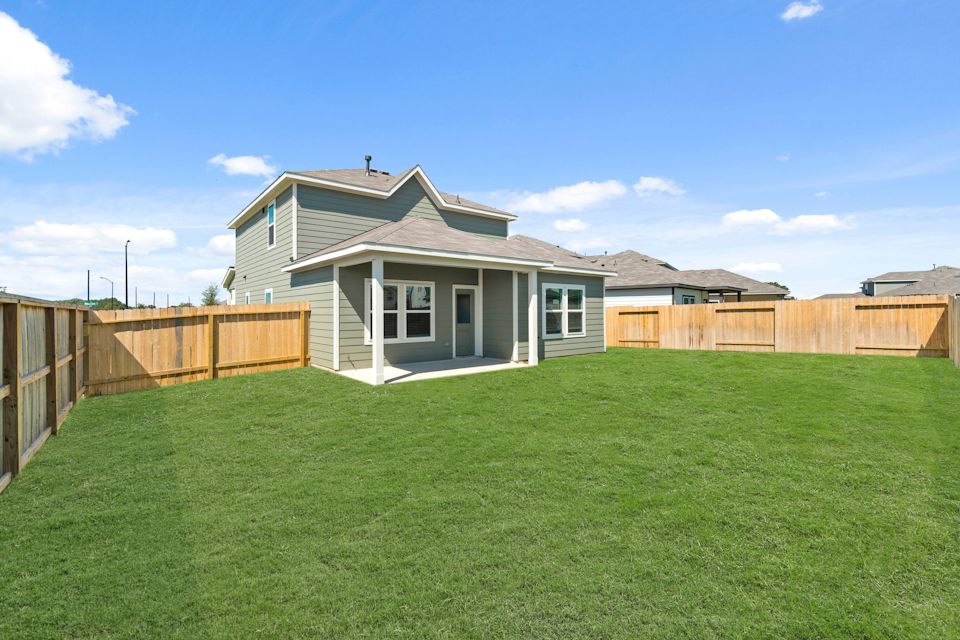 A house with a fence around it.