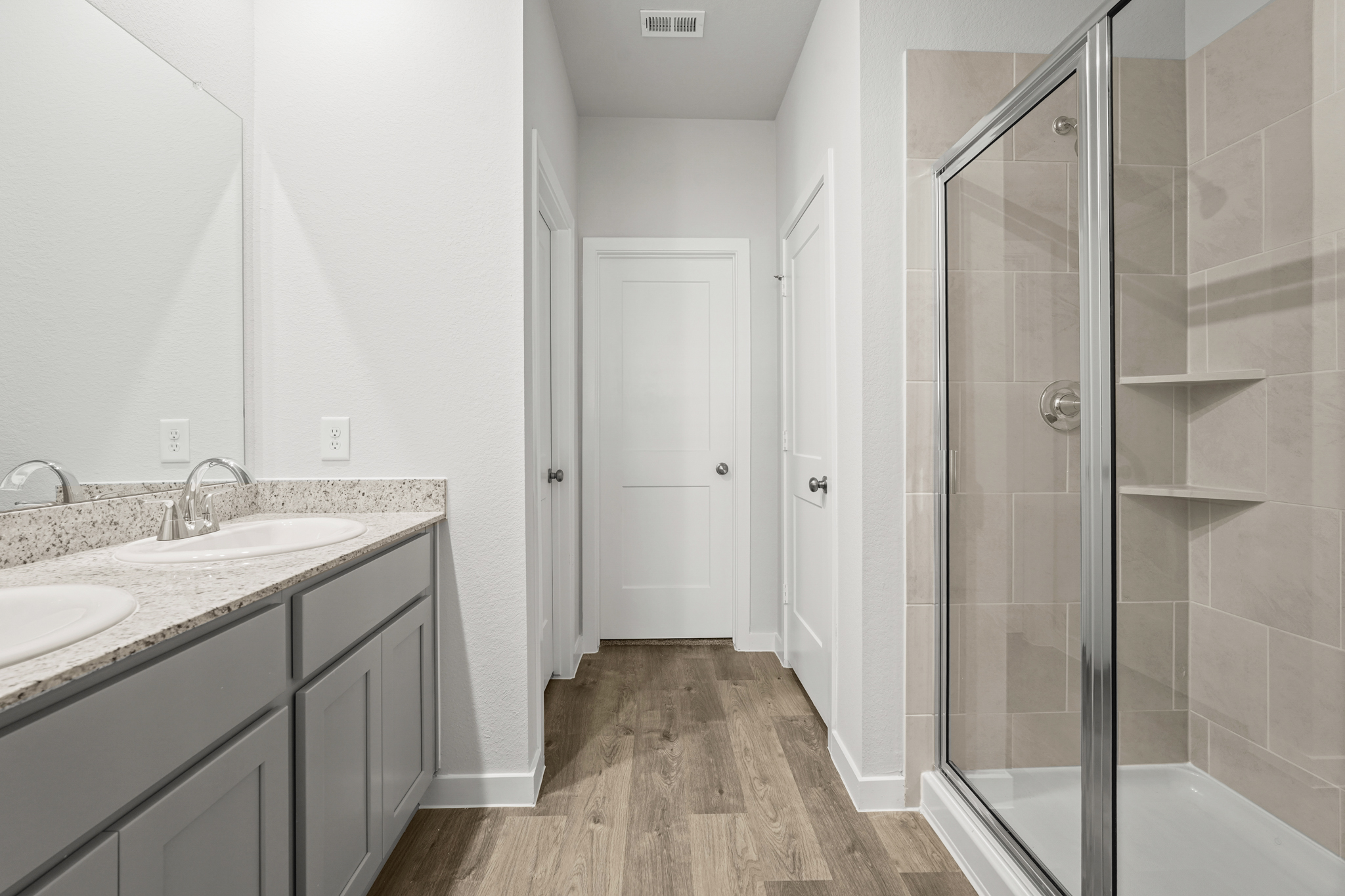 A bathroom with a glass shower.