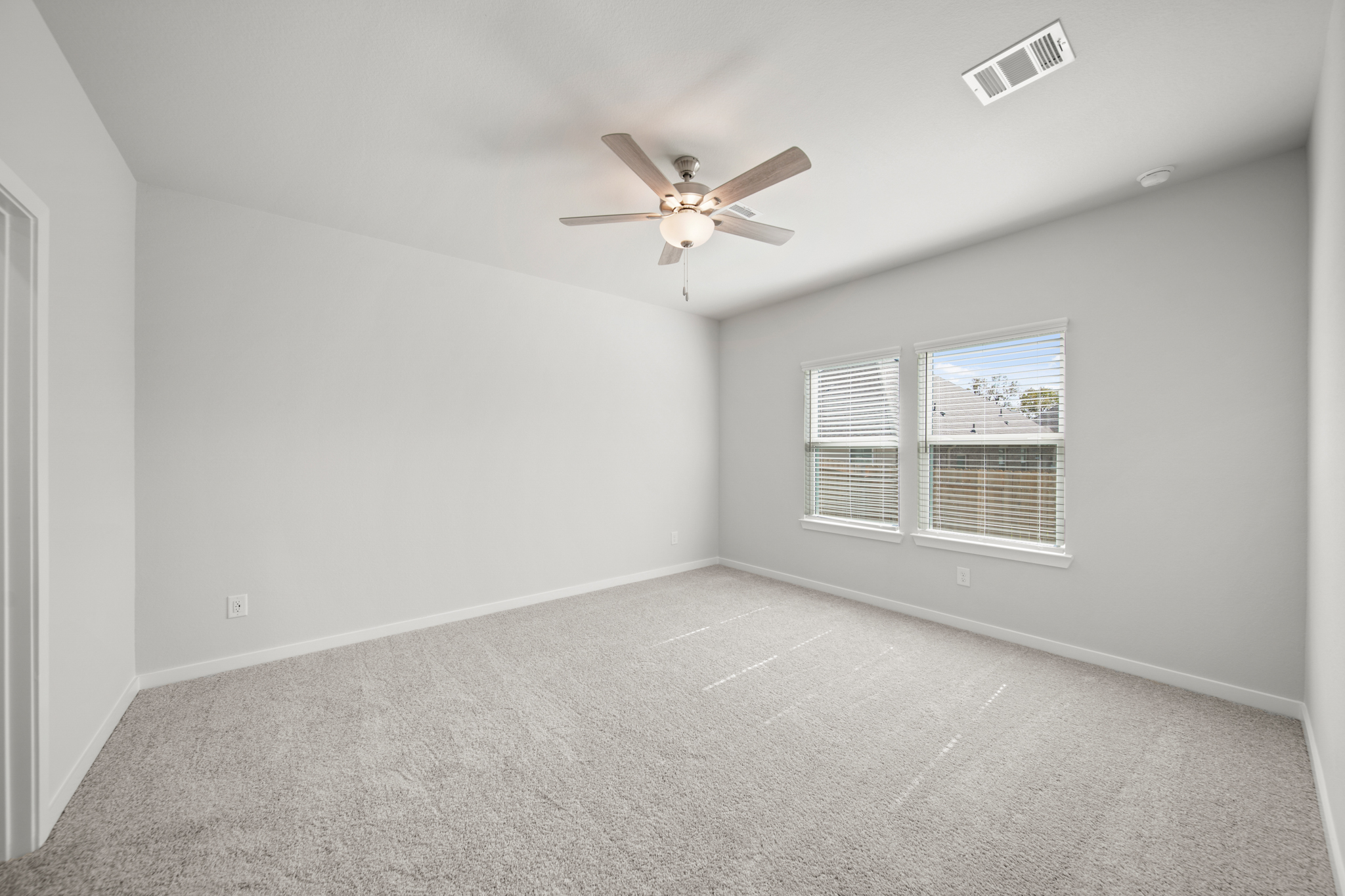 A ceiling fan in a room.