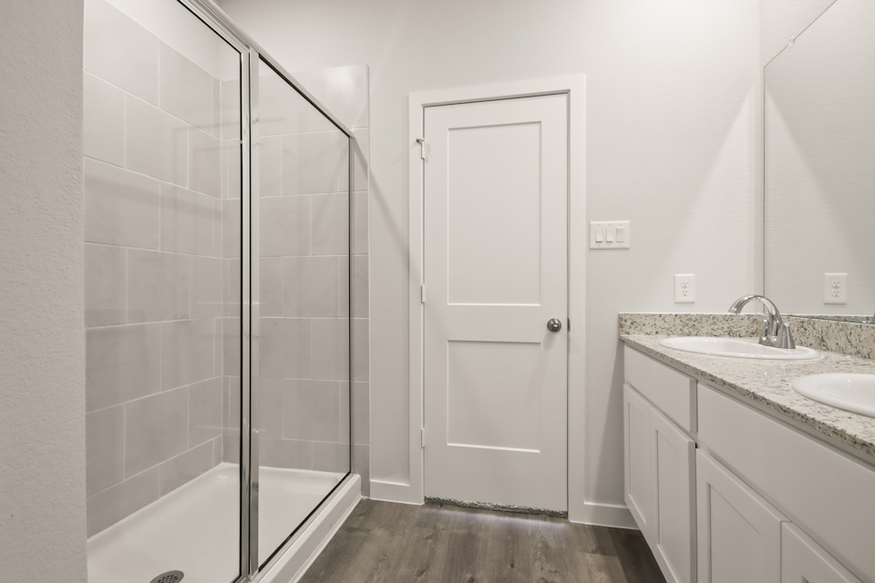 A bathroom with a glass shower.
