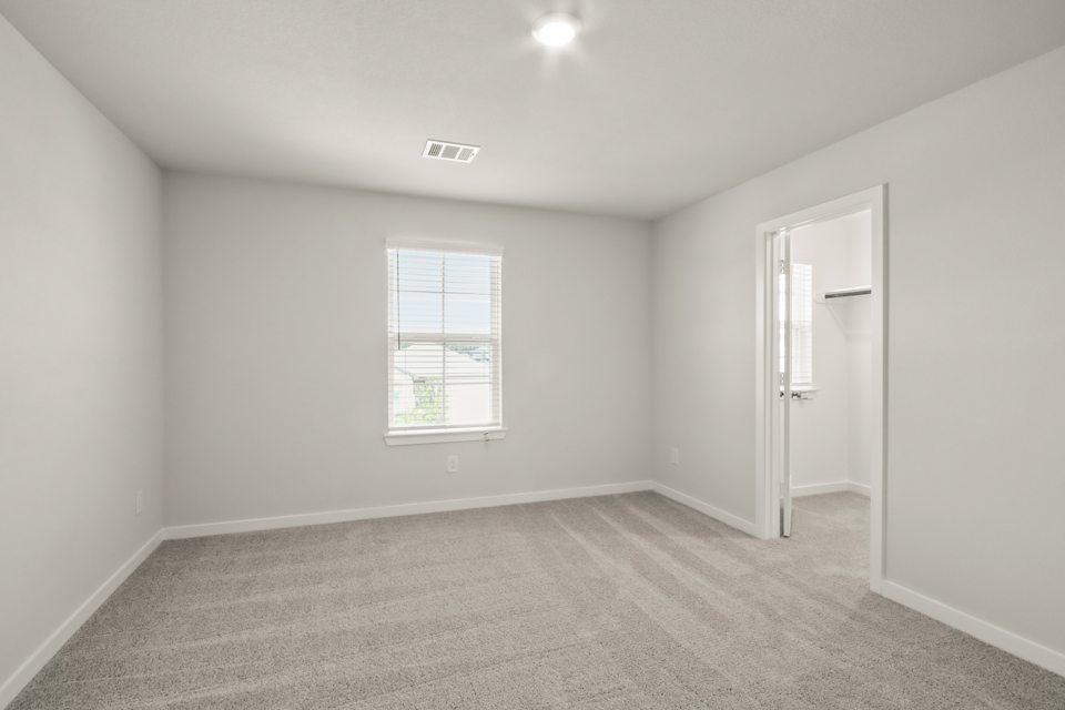 A room with a door and a window.