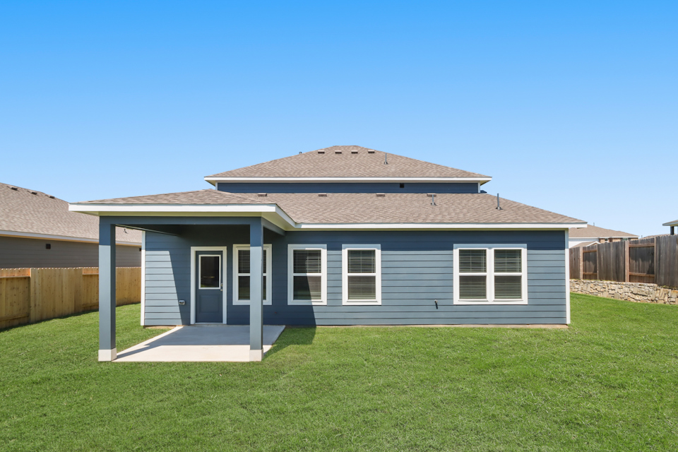 A house with a grass yard.