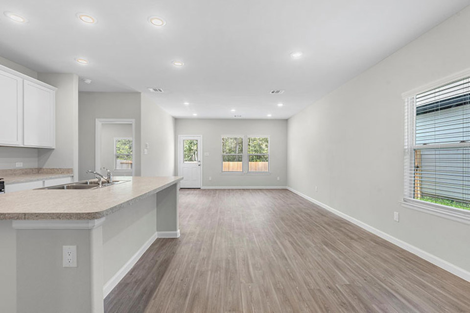 A large kitchen with white cabinets.