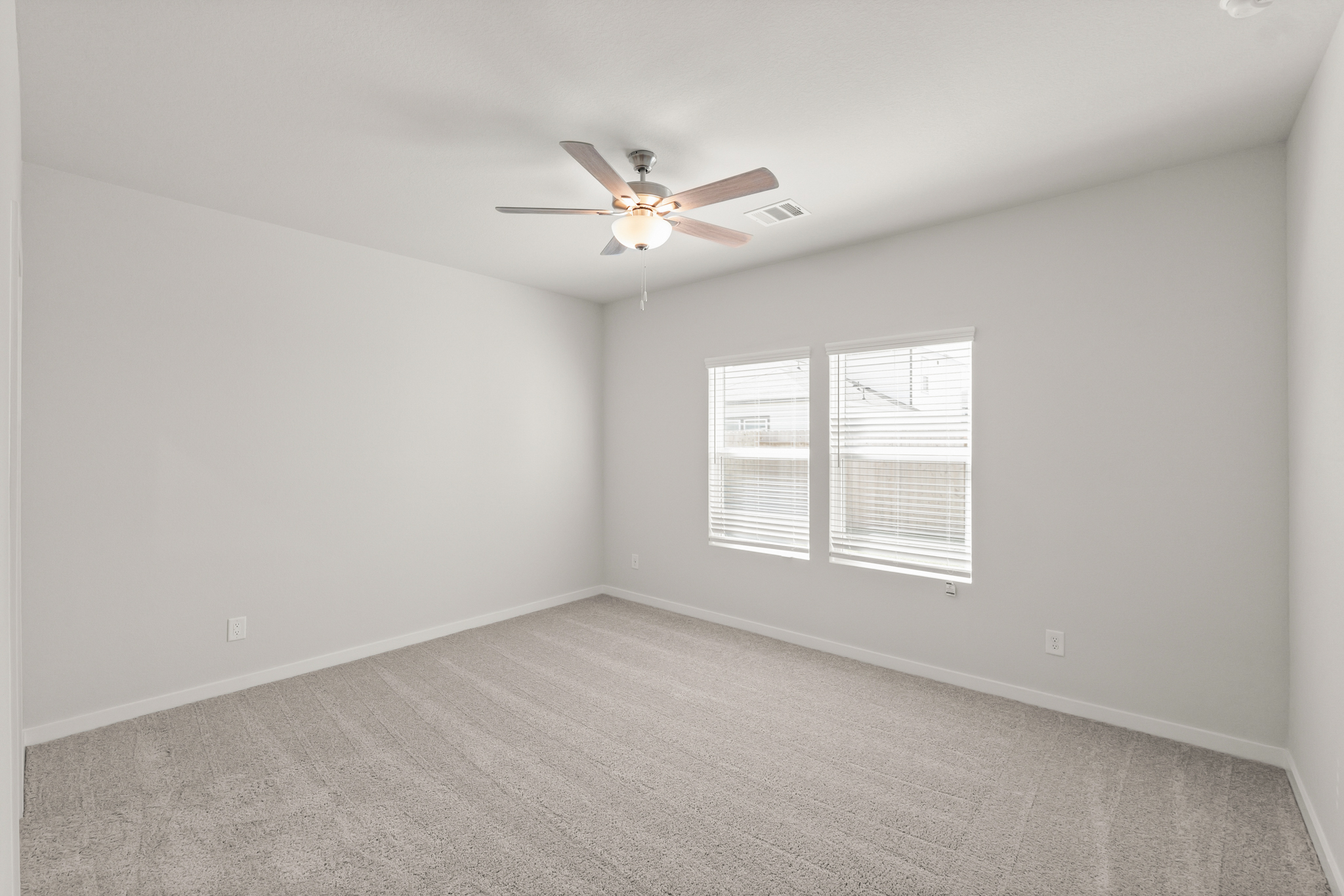 A ceiling fan in a room.