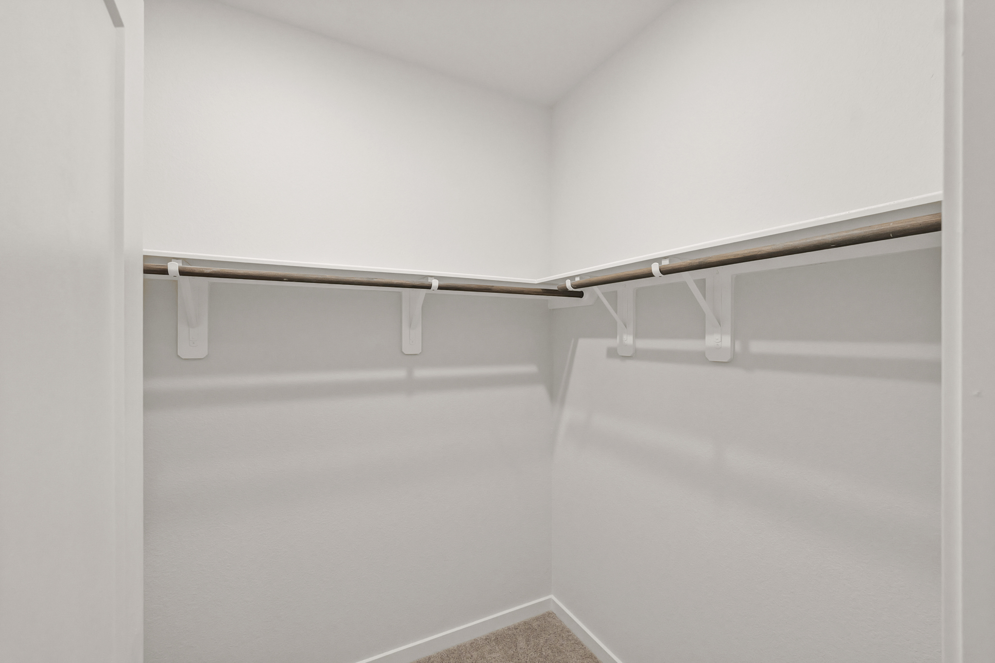 A metal bar on a white wall.