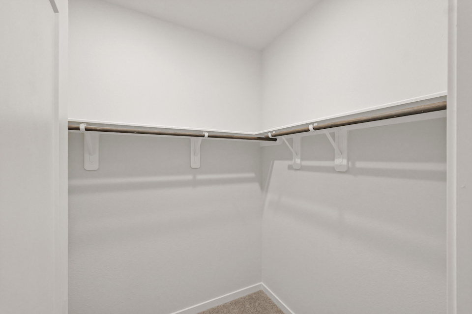 A metal bar on a white wall.