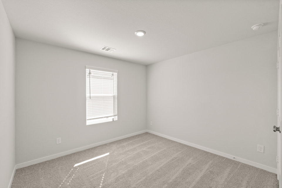 A room with a door and a window.